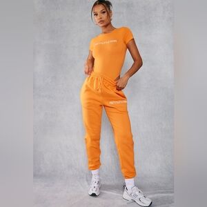 PrettyLittleThing Orange Track Pants Sporty Style